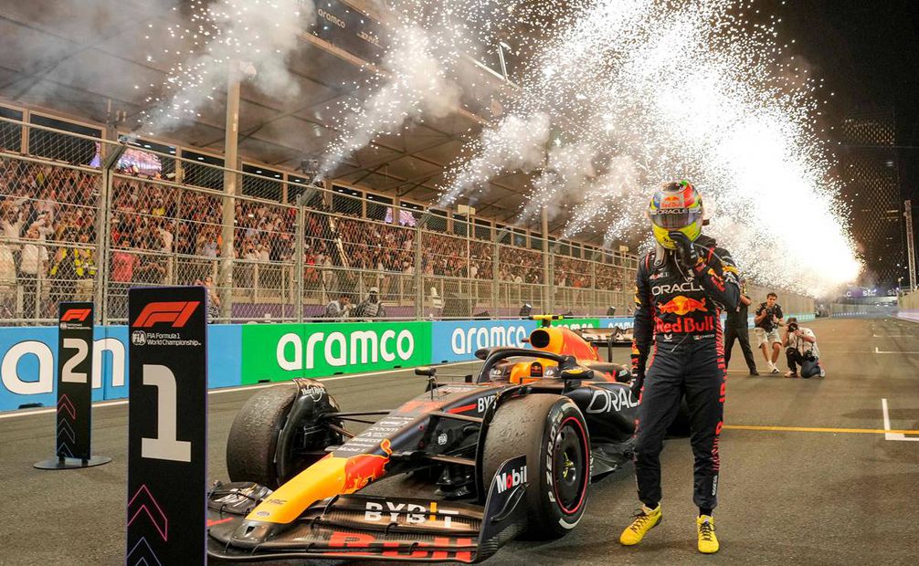 Red Bull Racing's Mexican driver Sergio Perez celebrates after winning the Saudi Arabia Formula One Grand Prix at the Jeddah Corniche Circuit in Jeddah on March 19, 2023. (Photo by Luca Bruno / POOL / AFP)