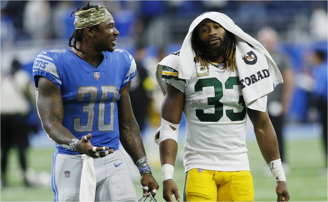 Jamaal Williams de Detroit y Aaron Jones de Green Bay compartiendo una charla al final del partido / Foto: AP