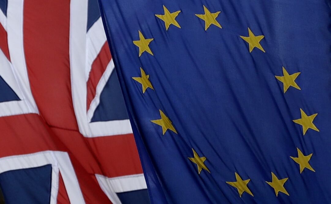 A European and British Union flags hang outside Europe House, the European Parliament's British offices, in London - Photo: Matt Dunham7AP Photo