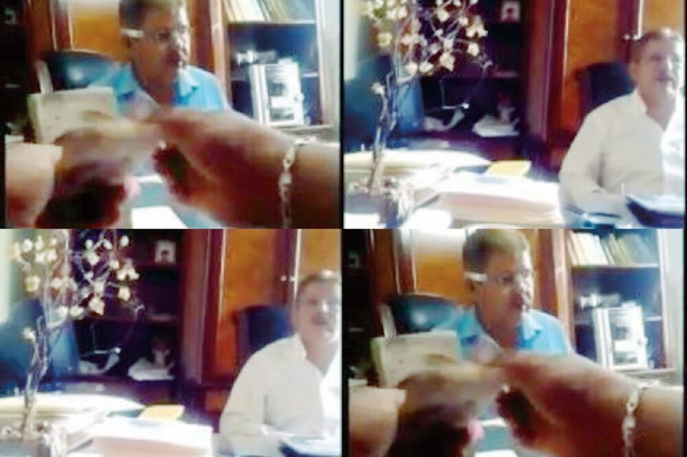 Entre la secuencia de imágenes se ve sentado al alcalde platicando con un interlocutor con el que al parecer negocia “el moche” de 30% de una obra. (TOMADAS DE VIDEO)