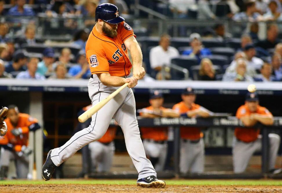 Evan Gattis (11) bateó un par de vuelacercas para que Houston doblegara a NY (ANDY MARLIN. USA TODAY SPORTS)