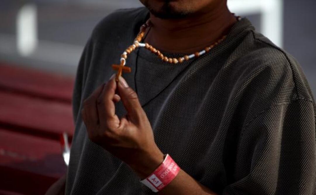 A man from Central America shows his rosary before making the run to the U.S. (Photo: Reuters)