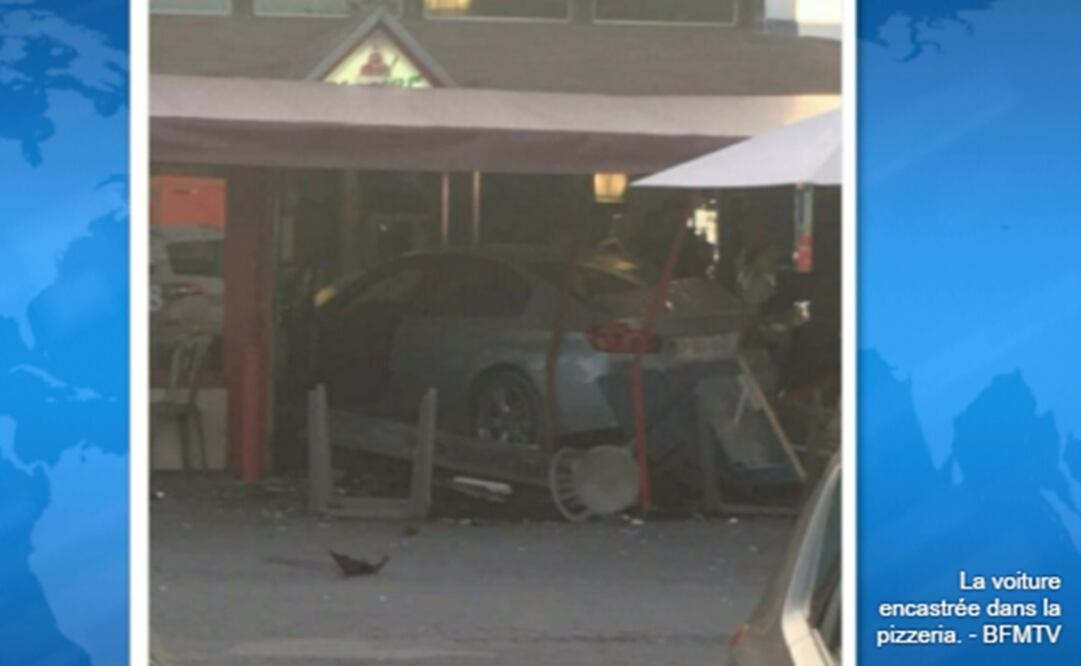 El canal de televisión "BFMTV" mostró imágenes del coche, un BMW azul, en el interior del establecimiento (Foto: BFMTV)