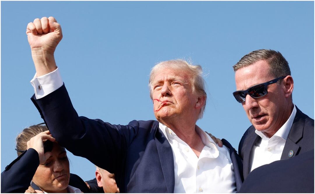 Donald Trump es protegido por el Servicio Secreto luego que intentaron atentar contra su vida. Foto: Anna Moneymaker/AP