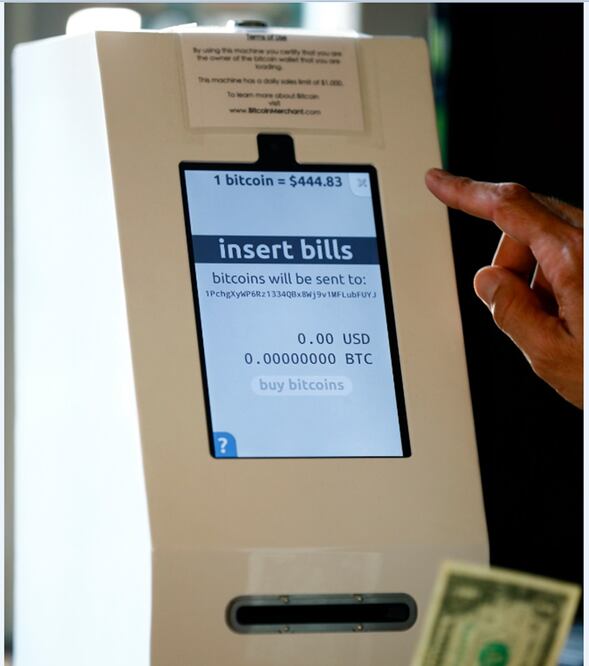 A bitcoin ATM machine. The device enables the user to convert cash to bitcoins via a QR code transfer to an application on their mobile device – Photo: Mike Blake/REUTERS