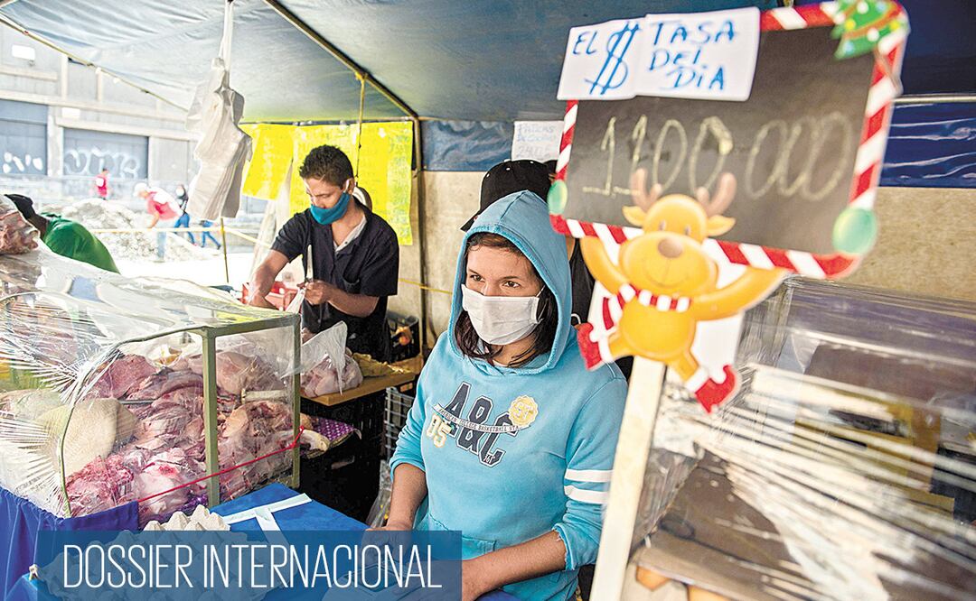 Una mujer en un mercado en Caracas, ayer previo a la jornada electoral que se realiza hoy. Los diputados que salgan de este proceso ejercerán a partir del próximo 5 de enero y hasta el 5 de enero de 2026. Foto: CRISTIAN HERNANDEZ. AFP