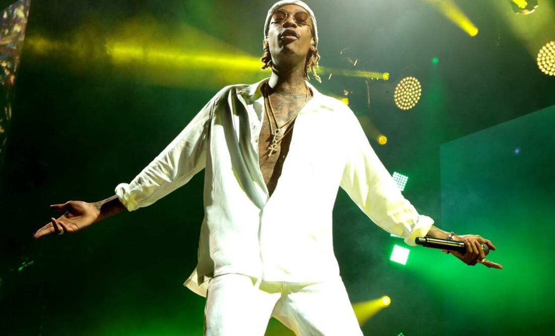 En esta foto del 5 de agosto del 2016, Wiz Khalifa canta durante un concierto de su gira "The High Road Tour" . FOTO: AP