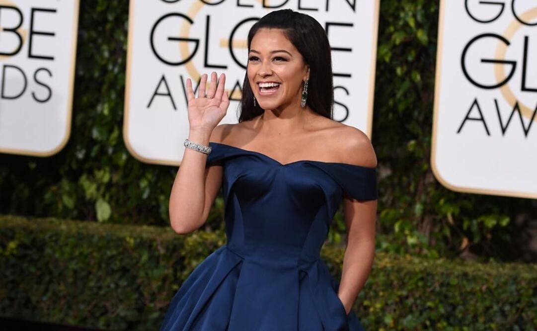 Gina Rodríguez kicked off the event in a blue princess gown. (Photo: AP)