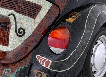 “Teotihuacan VW Bug” decorated with 480 pounds of jade and quartz arrives in Germany