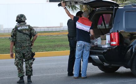 Cuerpo cae de cajuela de auto durante persecución en Quintana Roo