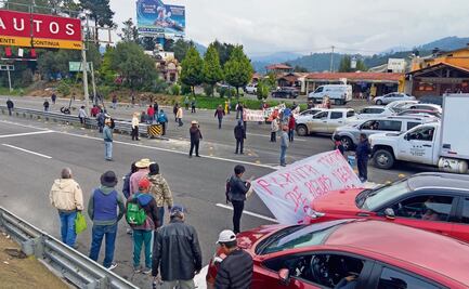 Ejidatarios bloquean la México - Toluca; exigen pago
