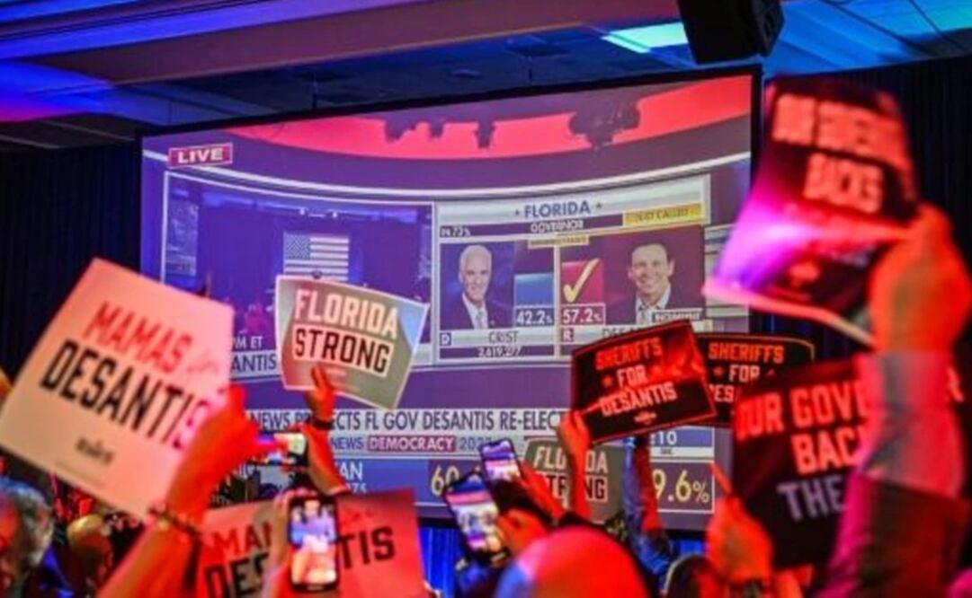  Simpatizantes del gobernador republicano de Florida, Ron DeSantis, aplauden mientras ven los resultados en Tampa, Estados Unidos. Foto: AFP