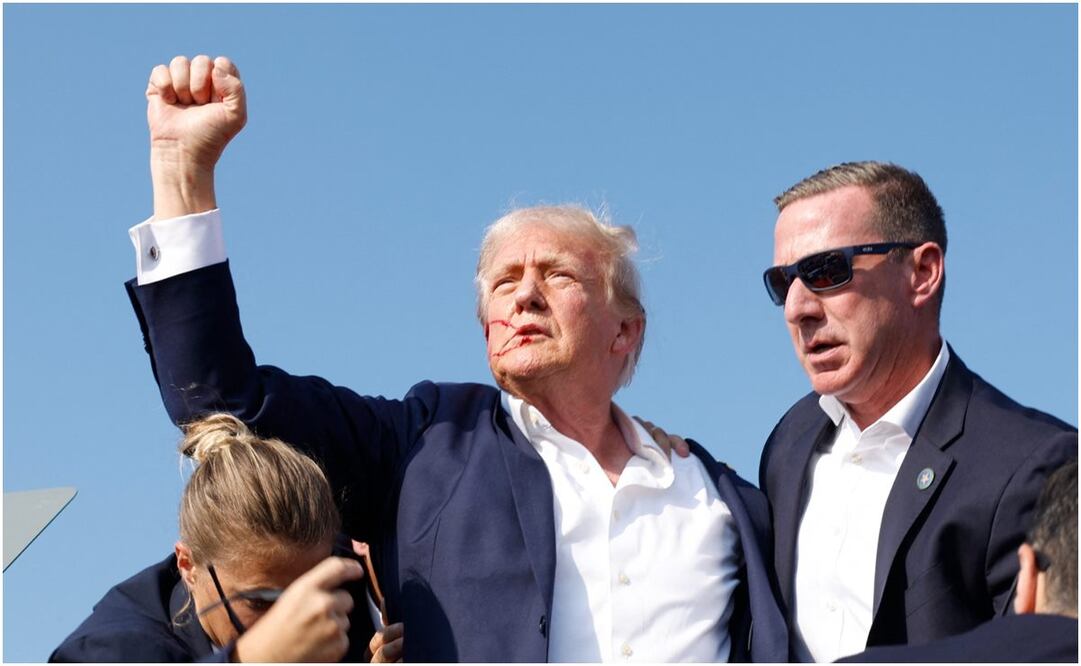 Donald Trump es protegido por el Servicio Secreto luego que intentaron atentar contra su vida. Foto: Anna Moneymaker/AP