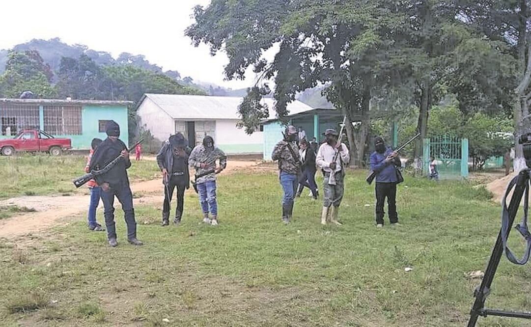 Ejidatarios de la comunidad Rafael Cal y Mayor se opusieron con armas al fallo de la Corte sobre las tierras. Foto: Especial