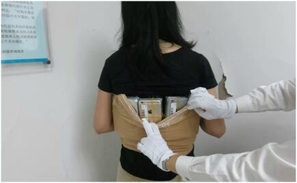 Detienen a mujer con 102 iPhones pegados al cuerpo