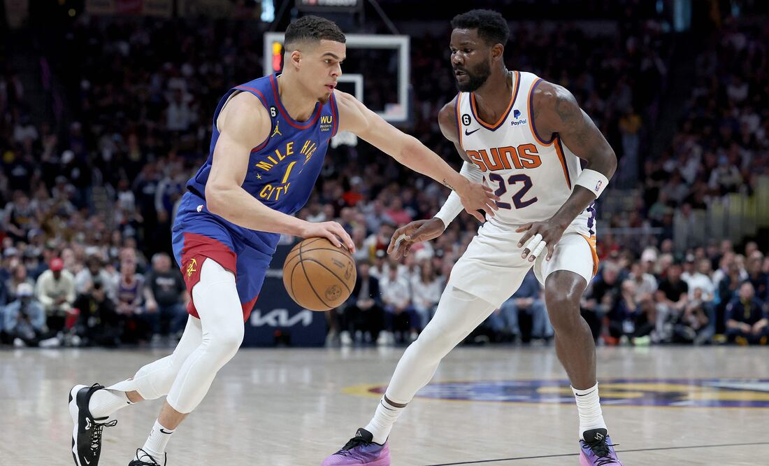 Michael Porter Jr eludiendo a Deandre Ayton / Foto: AFP