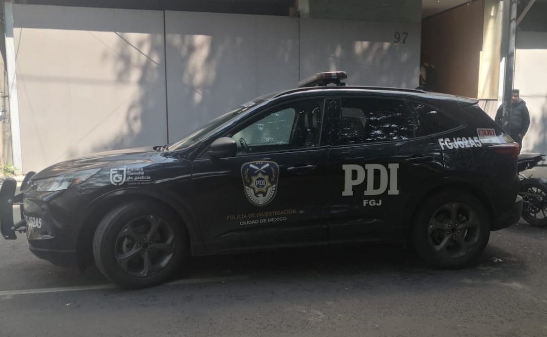 Peritos investigan la causa de muerte del gaurdia de seguridad. Foto: especial