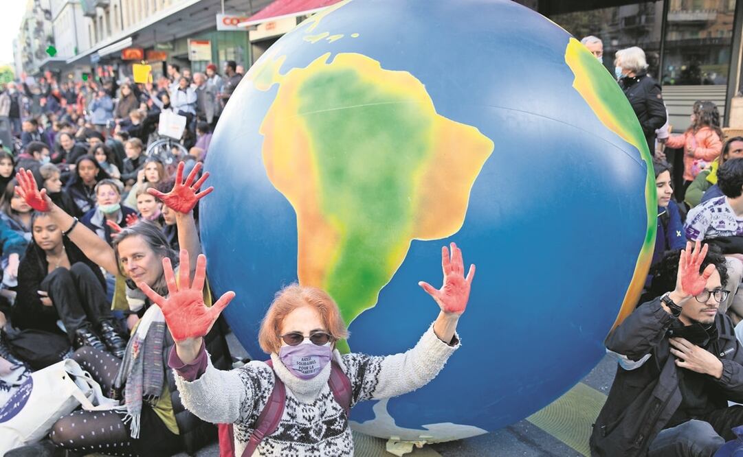 Manifestantes exigen a líderes mundiales actuar frente al cambio climático, durante una protesta en Ginebra, Suiza, el viernes pasado. Foto: Salvatore Di Nolfi. EFE