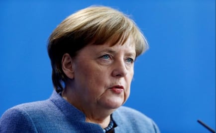 A divided Germany greets Merkel’s last grand coalition