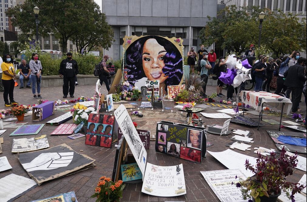 People gather in Jefferson Square awaiting word on charges against police officers - Photo: Darron Cummings/AP