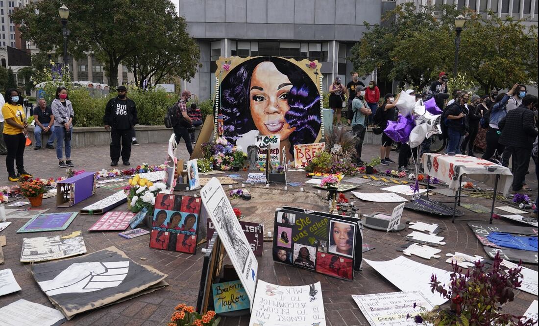 People gather in Jefferson Square awaiting word on charges against police officers - Photo: Darron Cummings/AP