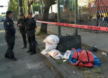 Abandonan feto entre basura sobre banqueta del Centro