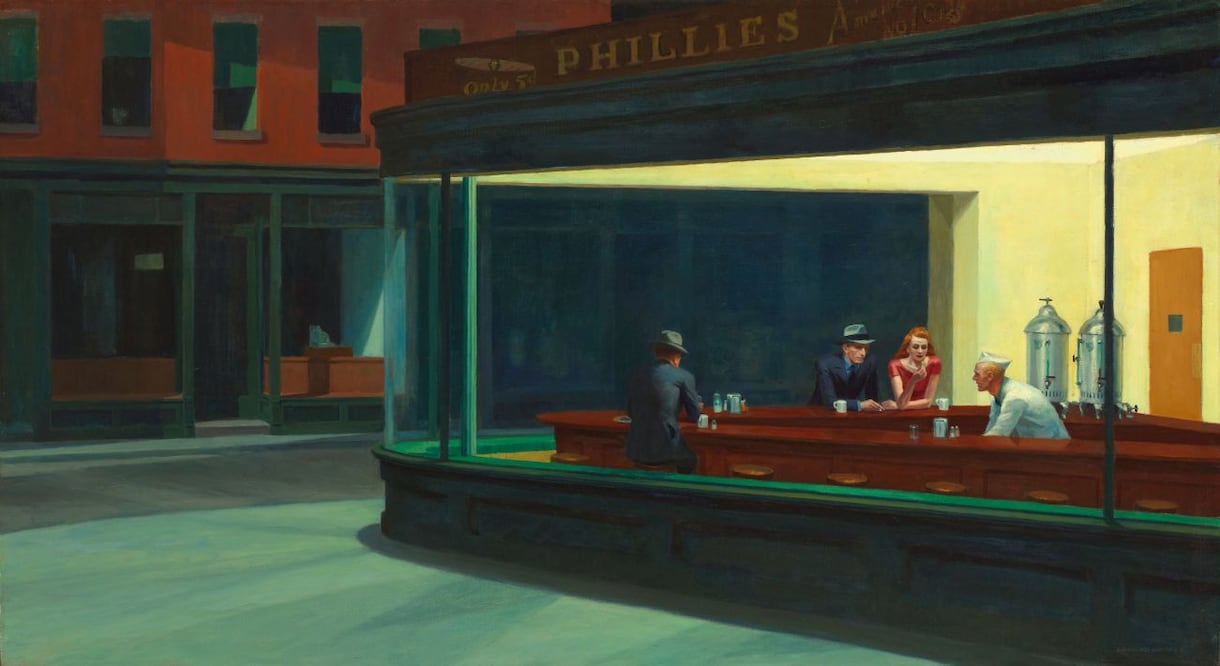 Pintada en 1942, esta obra de Edward Hopper titulada Nighthawks retrata un bar nocturno donde varios personajes comparten espacio sin interactuar. Crédito:  Art Institute of Chicago / dominio público.