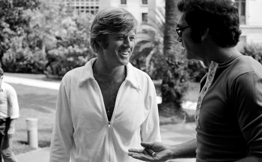 Foto tomada en mayo de 1972 que muestra al actor estadounidense Robert Redford (izq.) y al director Sydney Pollack durante el Festival Internacional de Cine de Cannes. 
Foto: AFP.