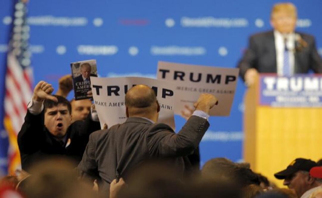 Supporters of U.S. Republican presidential candidate Donald Trump react as a protestor interrupts a campaign rally in Worcester, Massachusetts November 18, 2015. (Photo: Reuters)