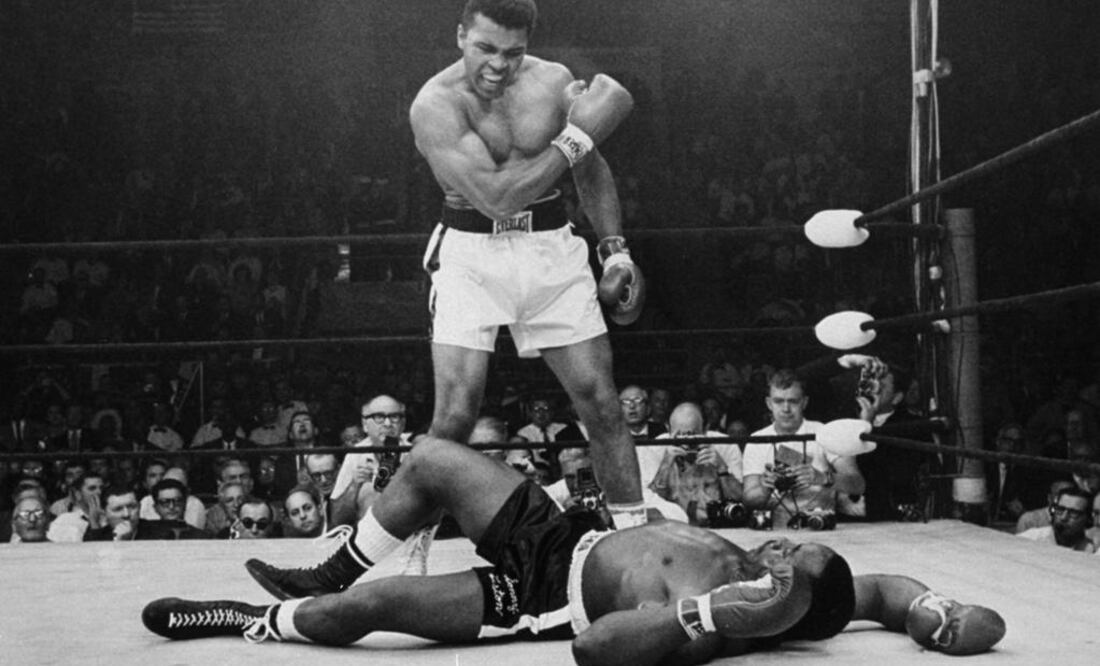 Ali, standing above Joe Frazier, daring him to stand up. (Photo: AP)
