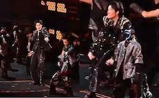 Con robots acróbatas, el cantante chino Wang Leehom sorprende en concierto