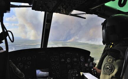 Esperan cambio meteorológico para contener incendio en Canadá 