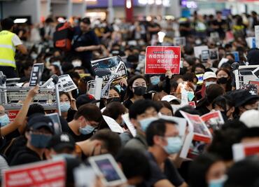 Chaos grips Hong Kong’s airport as riot police charge protesters