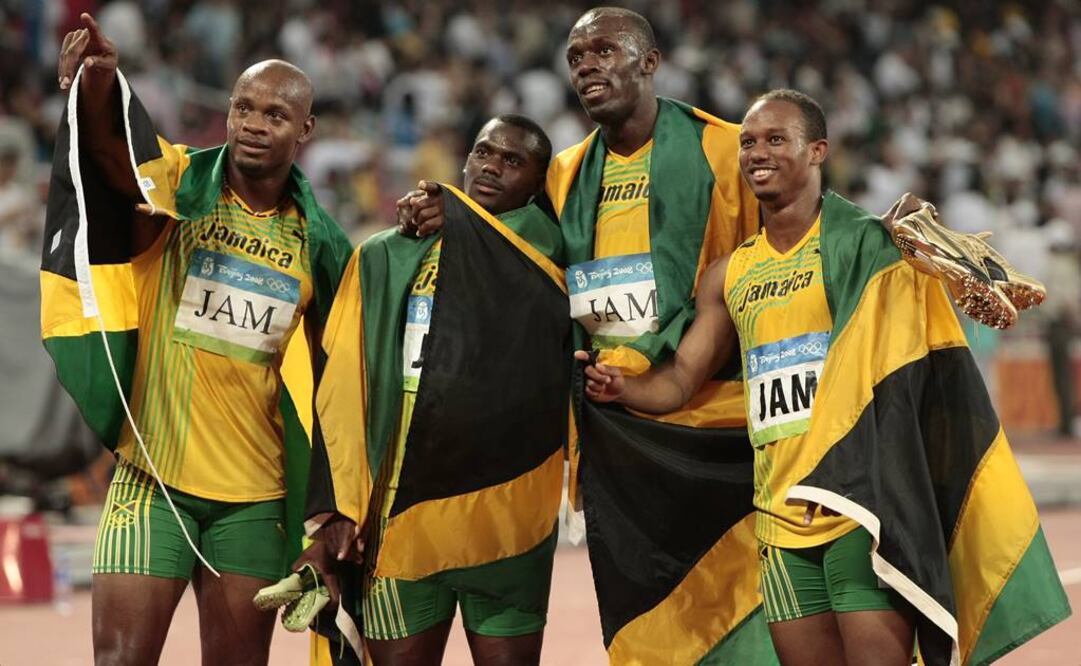 Usain Bolt con su equipo de relevos 4x100 metros en Beijing 2008. (Foto: AP)