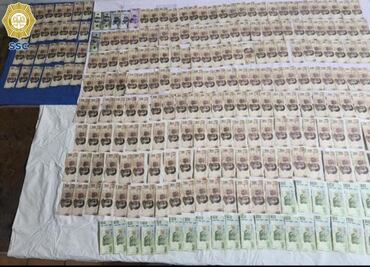 Catean centro de operaciones de falsificadoras de billetes; tenían escondite secreto en una coladera