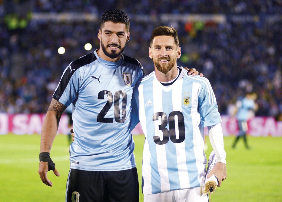 REUTERS. Luis Suárez y Lionel Messi