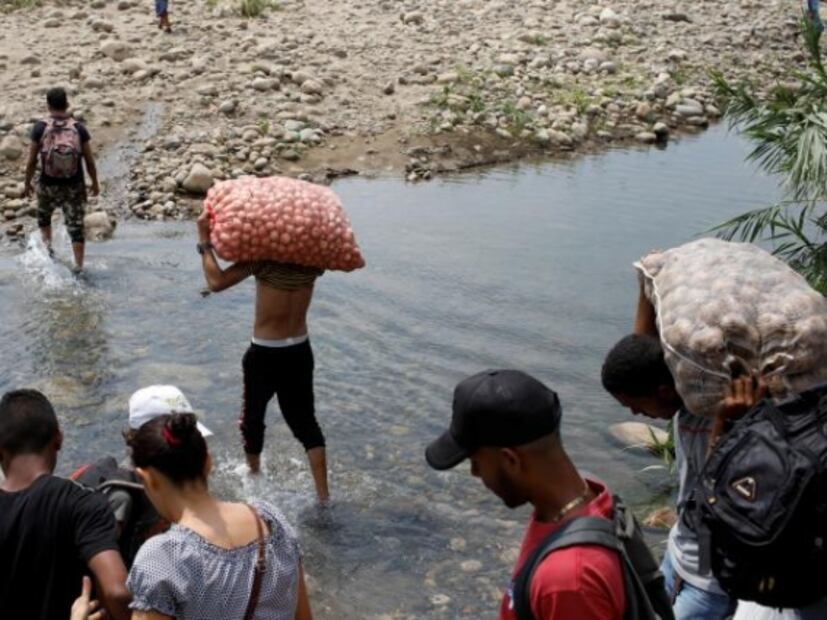 Tras cierre de frontera, grupos criminales lucran con venezolanos que cruzan a Colombia