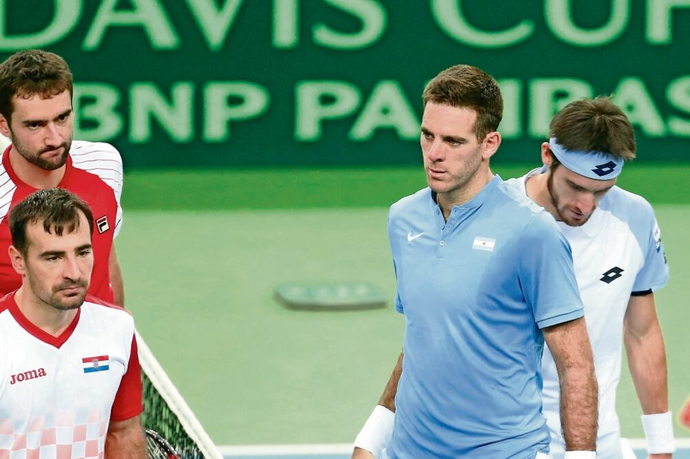 Marin Cilic e Ivan Dodig (izq.) derrotaron a Juan Martín del Potro y Leonardo Mayer. (FOTO: DARKO BANDIC. AP)