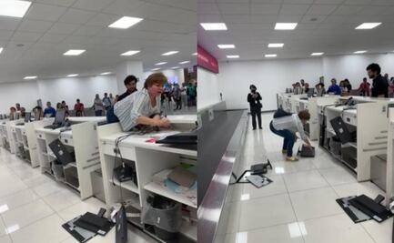 Mujer enfurece y rompe equipo de cómputo en AICM; policías la detienen: VIDEO