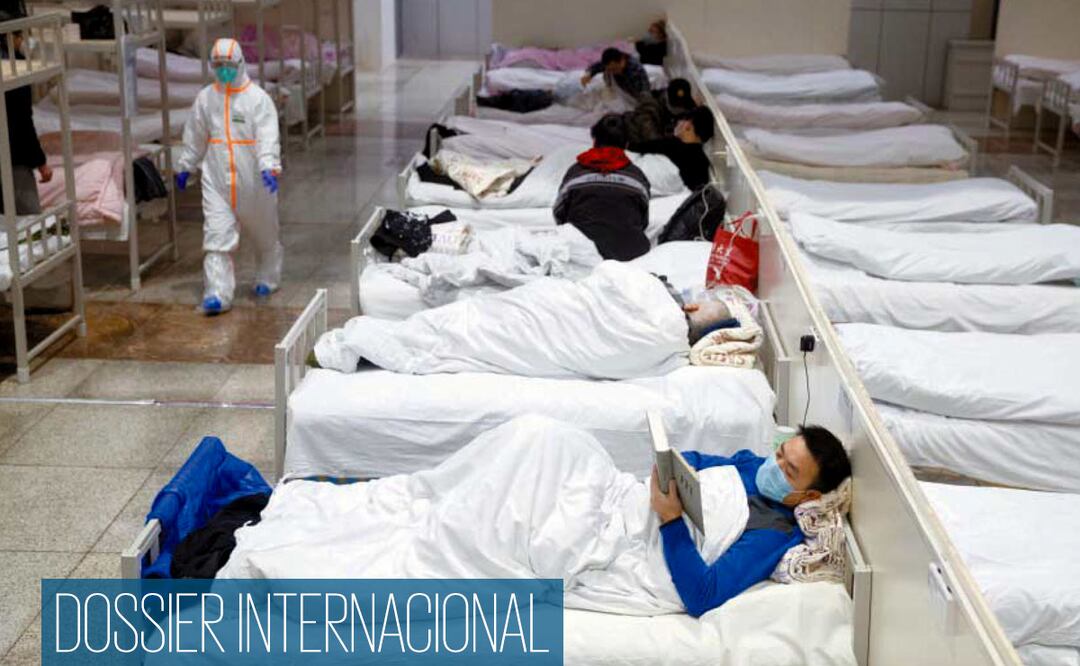 Pacientes infectados con el coronavirus, en el Centro Internacional de Exposiciones y Convenciones de Wuhan. Foto: EFE