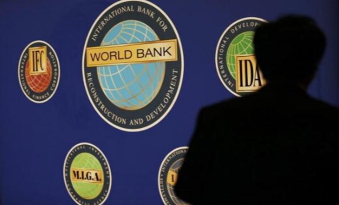 A man is silhouetted against the logo of the World Bank Photo:Kim Kyung Hoon/Reuters