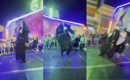 ¡Perdió el piso! Captan caída de la "Monja de la Feria” mientras bailaba en juego mecánico: VIDEO