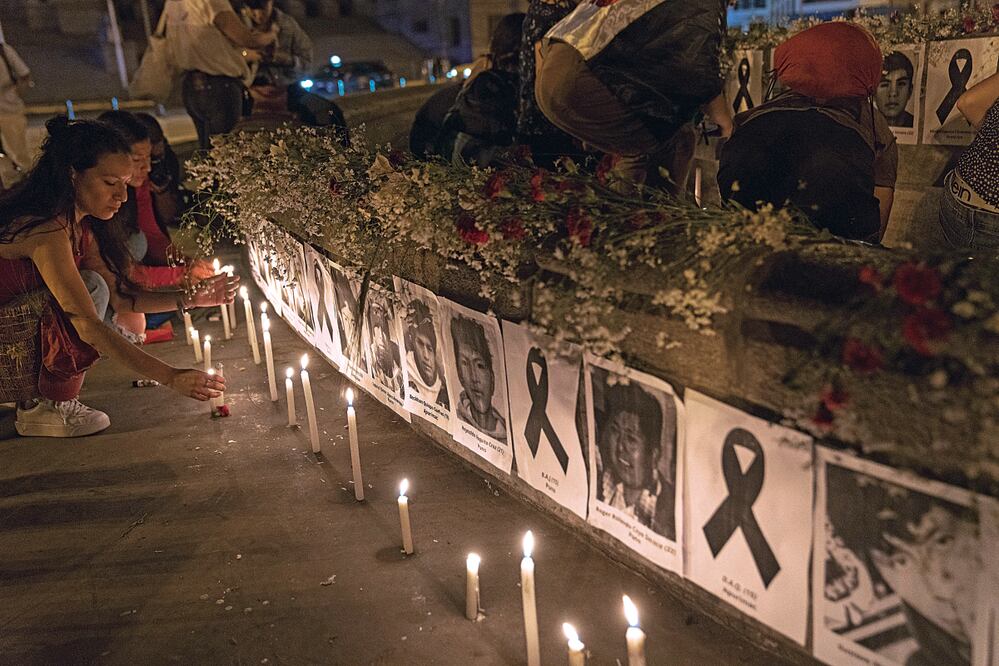 Asistenters a una vigilia. Foto: AP