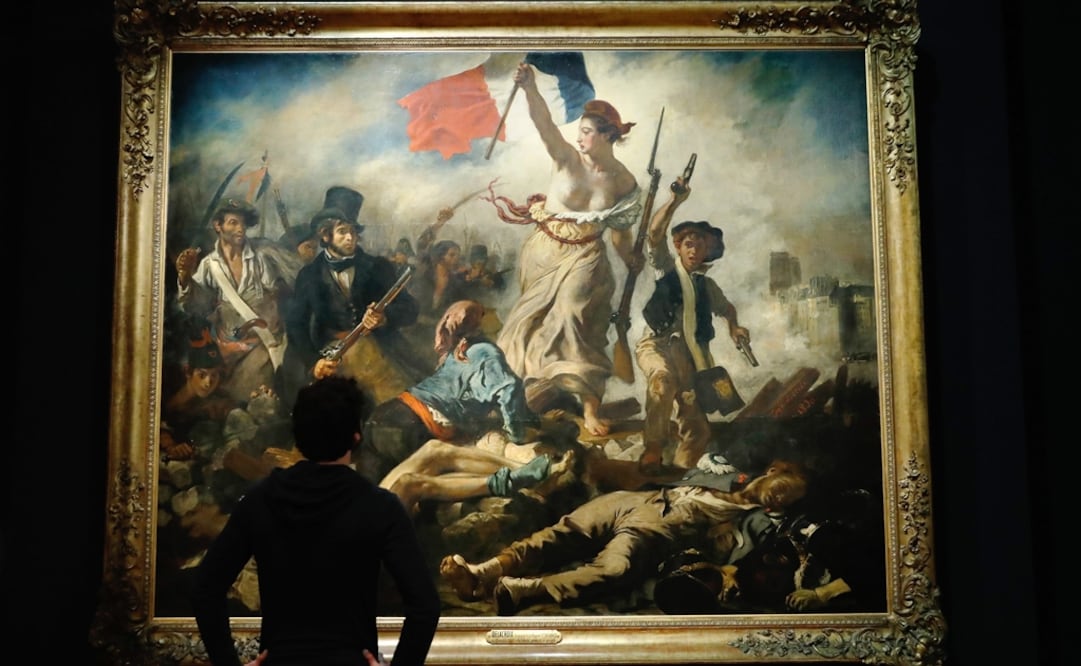 El Louvre dedica una gran retrospectiva a Eugène Delacroix, autor del lienzo "La Libertad guiando al pueblo". Foto: AFP / PATRICK KOVARIK
