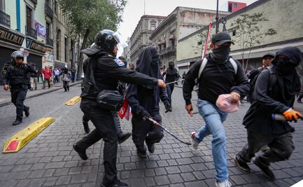 Reportan riña entre policías y encapuchados durante marcha del Día del Trabajo; Bloque Negro realiza actos vandálicos en tiendas
