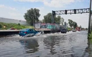 Tras lluvias de ayer, amanece inundada avenida Gran Canal en la GAM; encharcamientos impiden tránsito