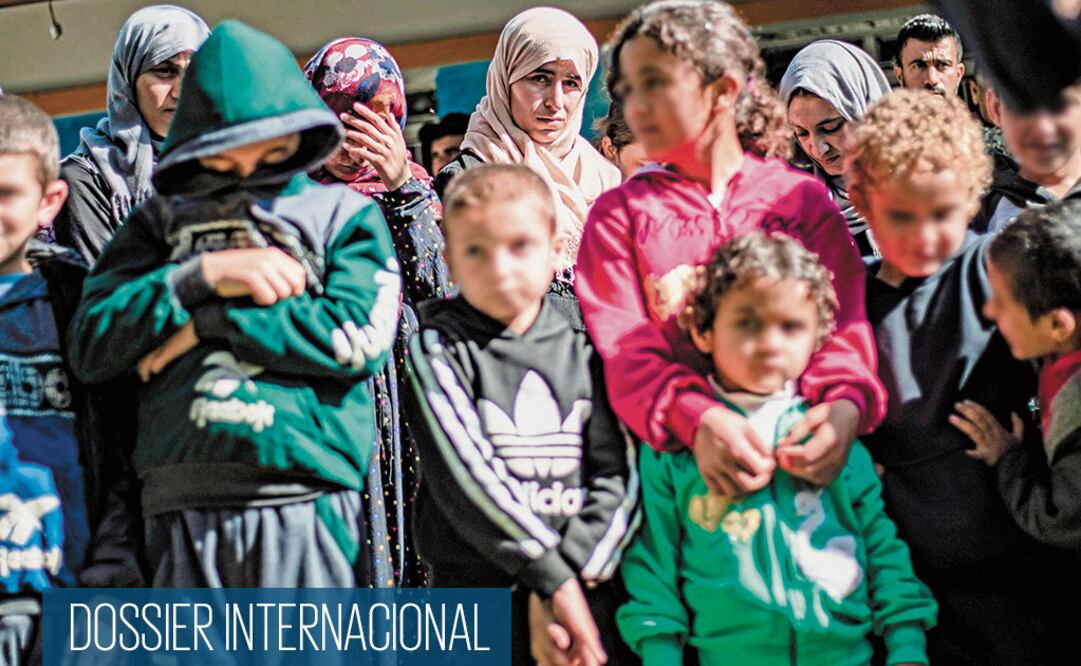 Mujeres y niños yazidíes en un refugio en Siria. Fueron rescatados tras estar en manos del Estado Islámico. DELIL SOULEIMAN. AFP