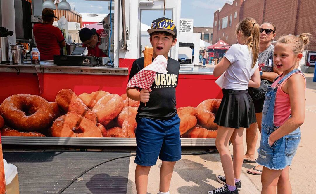Asistentes a la Feria Estatal de Indiana, que fue inaugurada el viernes pasado, en el Recinto Ferial y Centro de Eventos del estado. Foto: Spencer Platt / AFP