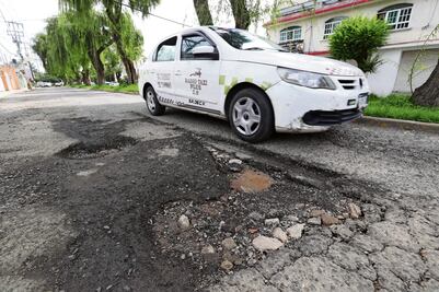 Baches provocan daños de $8 mil en autos
