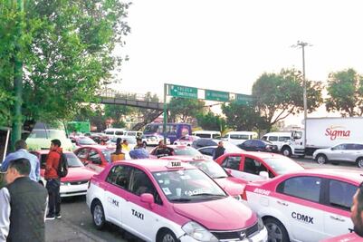 Con bloqueos, rechazan modernizar taxímetros